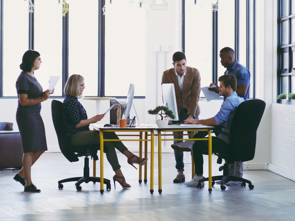 A team meeting focused on the importance of accurate information, highlighting its role in effective decision-making and collaboration.